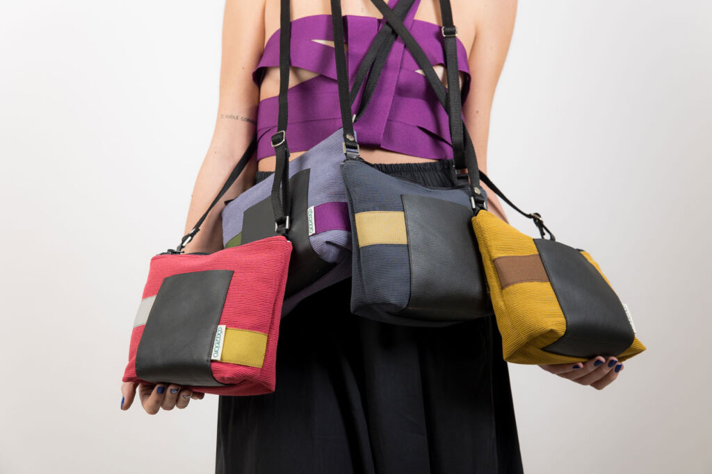 A model wearing a number of Coccadoro handbags