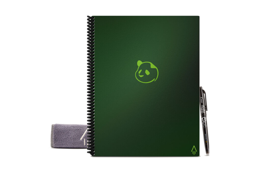 A green coloured Rocketbook Panda Planner with a pen ready to be used