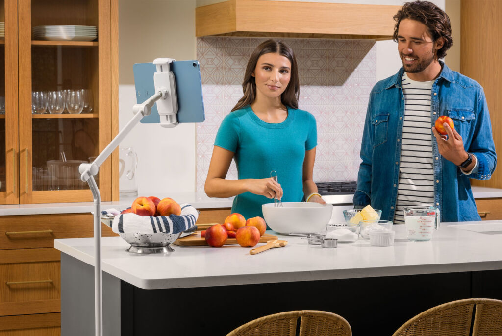 A young couple using the hover bar in a kitchen