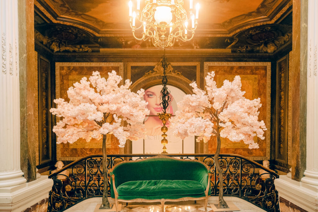 Luxurious touches were featured throughout the fair, including this gold and velvet chaise surrounded by flowers in the lobby