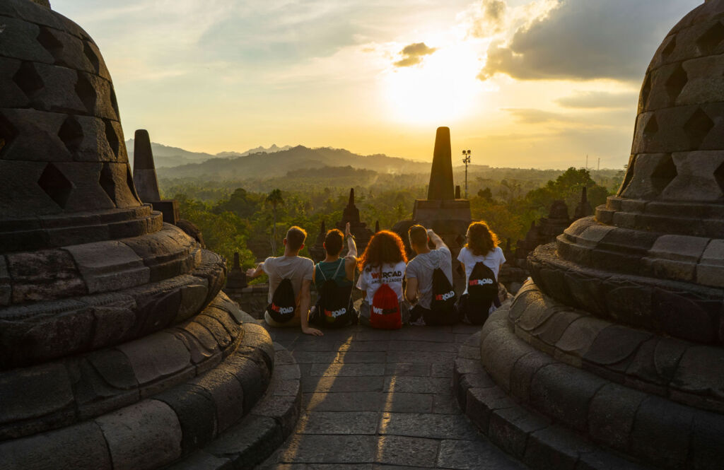 Young people taking in the view at a temple in Indonesia