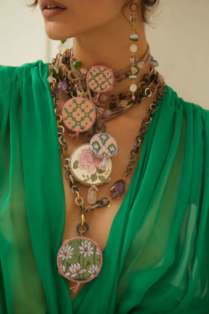 A model wearing a large Amle necklace