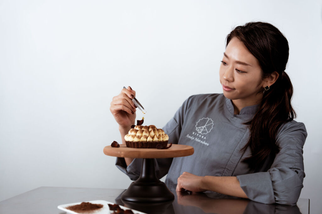 Chef Asuka putting the finishing touches to one of her desserts
