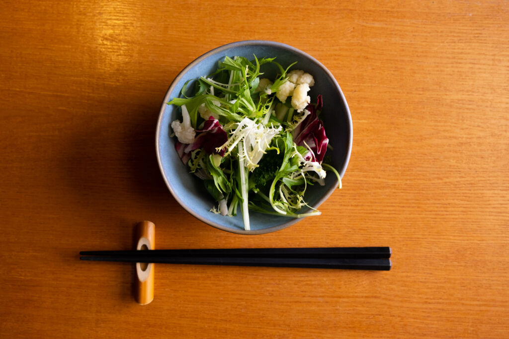 The Mizuna salad with some chopsticks