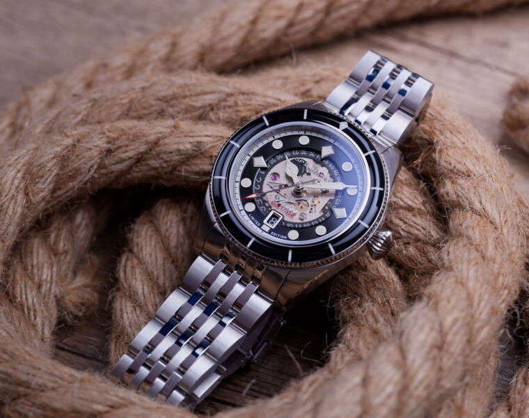 The steel version of the diver's watch on a coil of rope