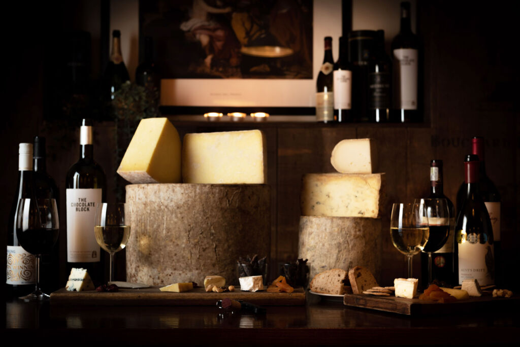A selection of cheeses and wines inside the cheese room