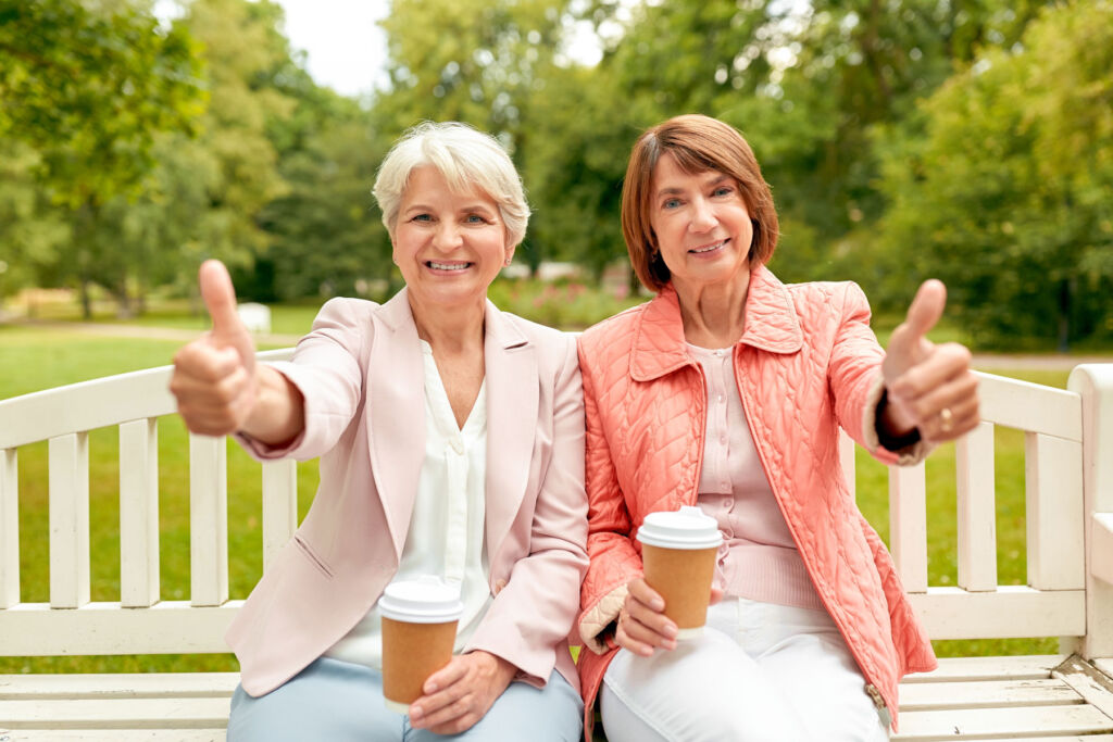 Thumbs up from two female pensioners