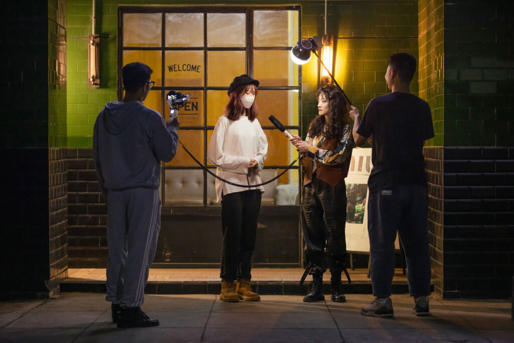 The lights being used on location for an outdoor interview