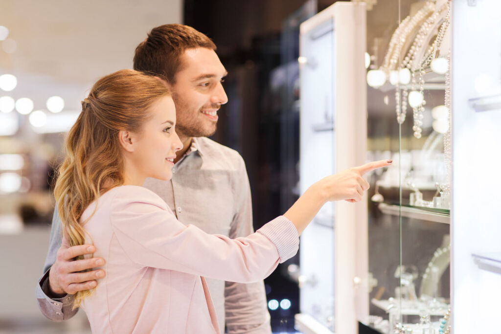 A young couple shopping for jewellery