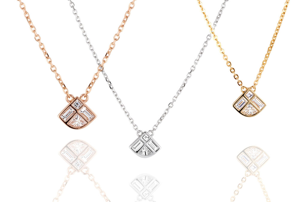 Kate Spade's diamond cut fan shaped necklaces on a white background