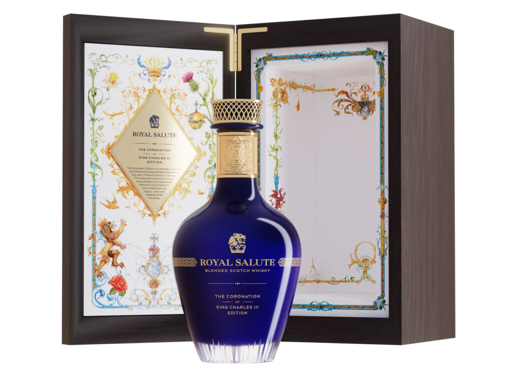 A bottle of Royal Salute Coronation of King Charles III Edition with its open wooden case behind