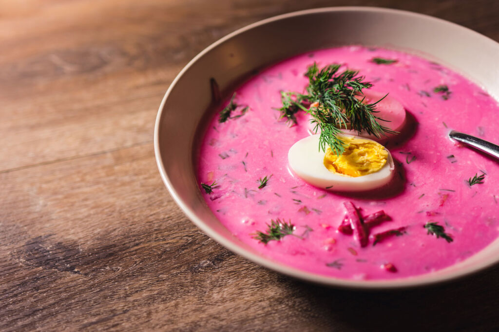 A close up view of a bowl of the pink coloured soup