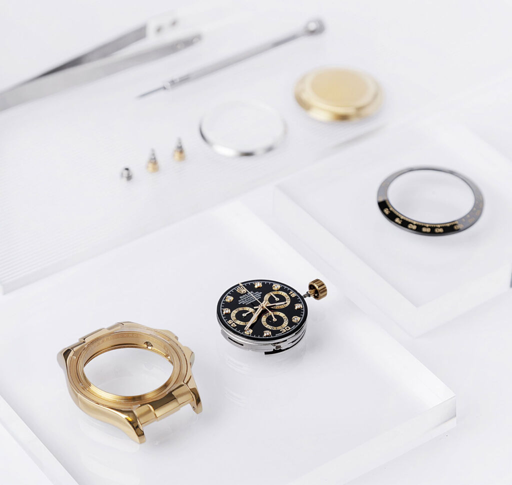 The watch components displayed on a table