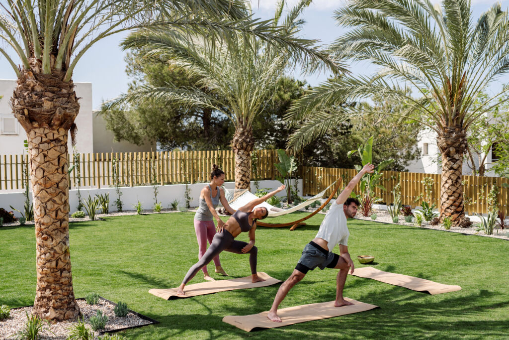 Guests taking a yoga class in their garden