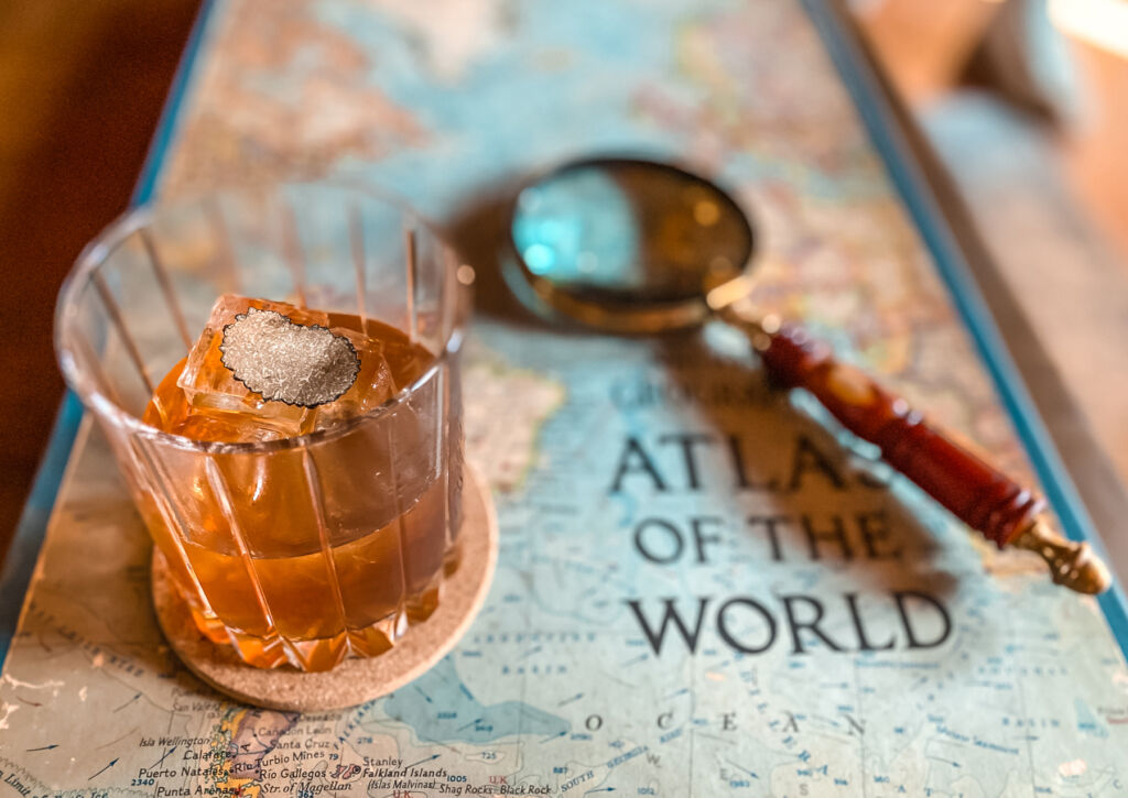 A Truffle cocktail on top of a world map