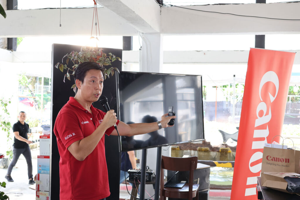 One of the members of the Canon Team talking to attendees