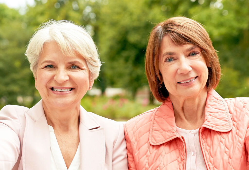 Two older women sat outdoors
