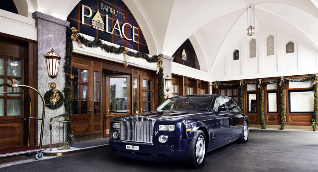 The Rolls-Royce motor car parked outside the hotel entrance