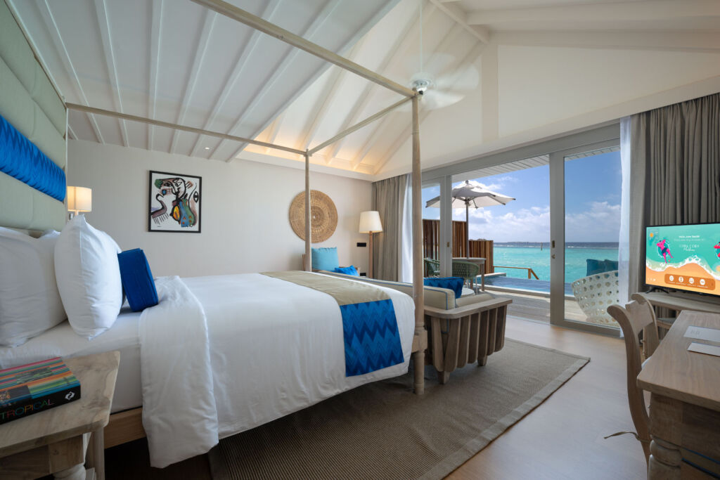 The bedroom in the Lagoon Pool Villa with its views out over the open sea