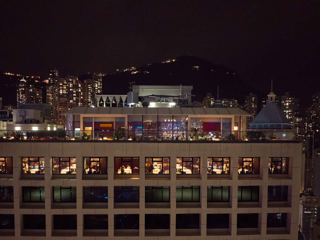 An aerial view via a drone of the rooftop venue at night