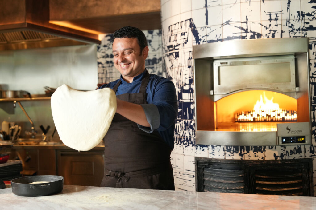 Chef Vincenzo Gatti making a pizza base