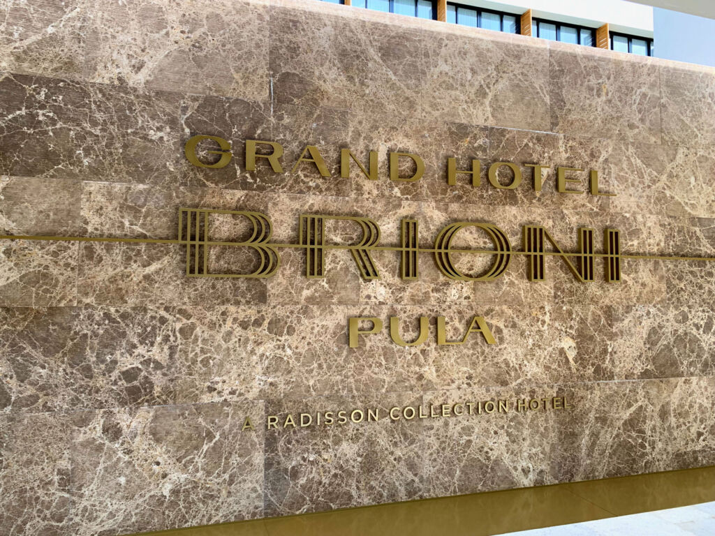 The gold coloured signage on the hotel's exterior