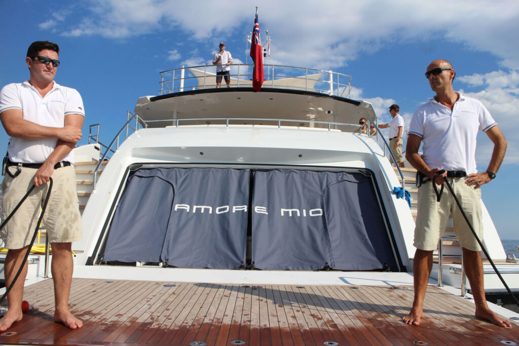 Crew members readying the Heesen Amore Mio yacht