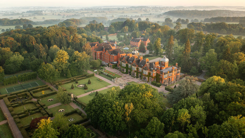 An aerial view of Hoar Cross Hall Hotel and Spa, showing the sprawling building and its grounds