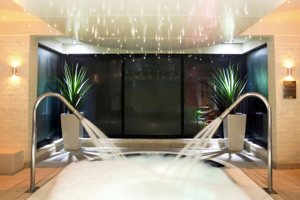 An indoor pool with high power massaging water jets