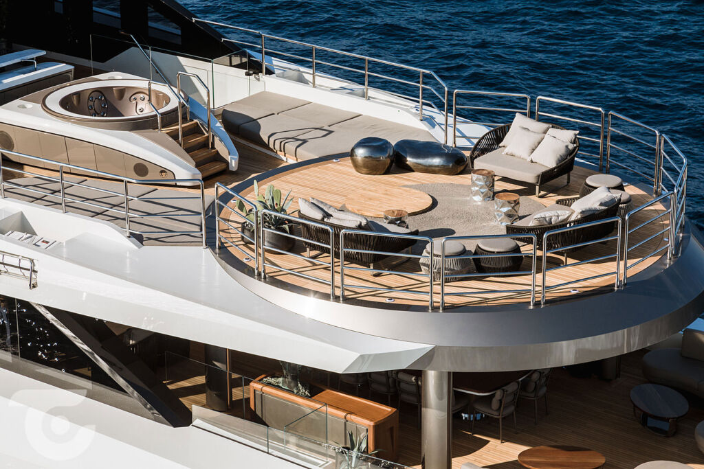 A luxuriously appointed upper desk on a superyacht with a spa pool