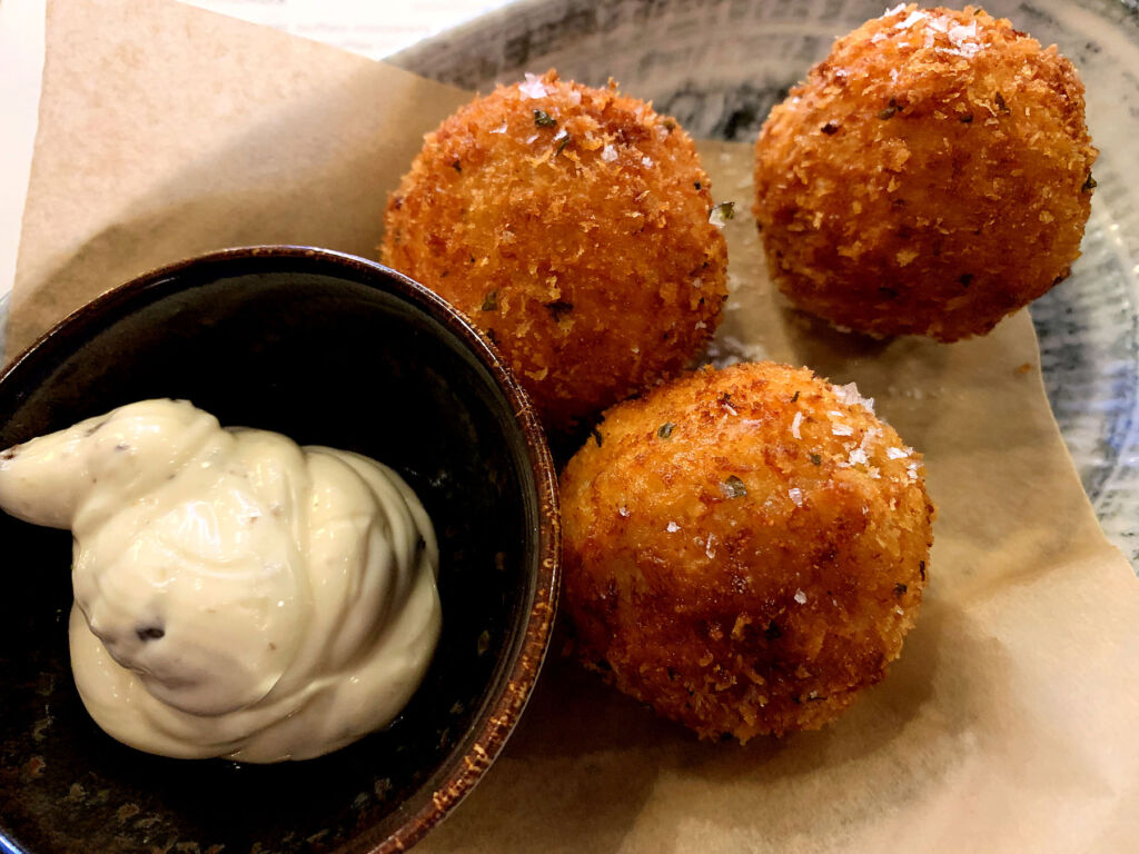 The Arrancini dish with a dipping sauce