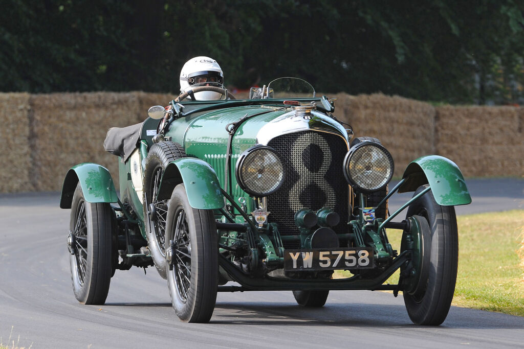 The green coloured 1928 Bentley 4.5 Litre being driven at speed