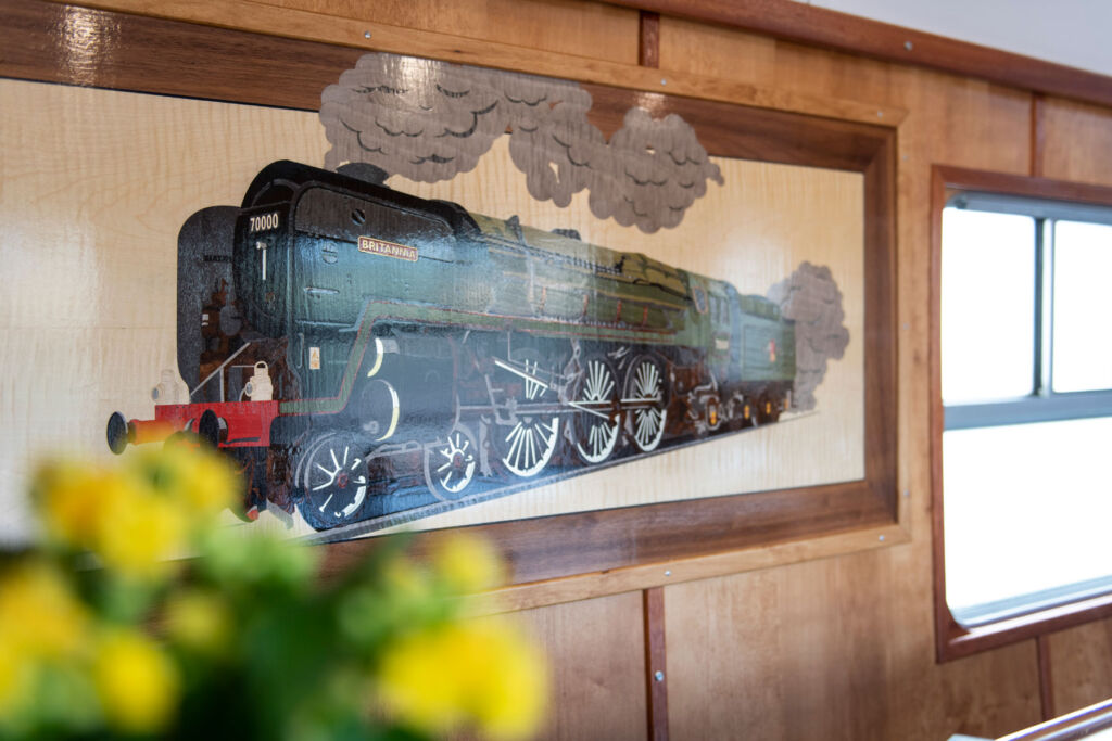 The railway-themed marquetry in one of the carriages