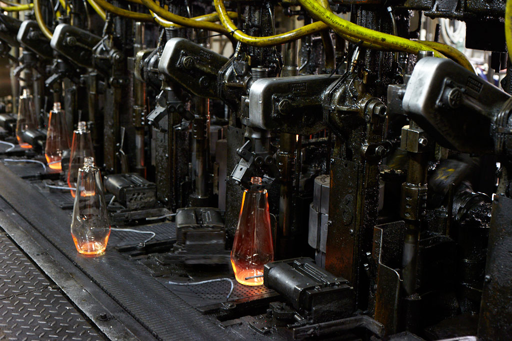 A machine constructing the iconic glass bottles