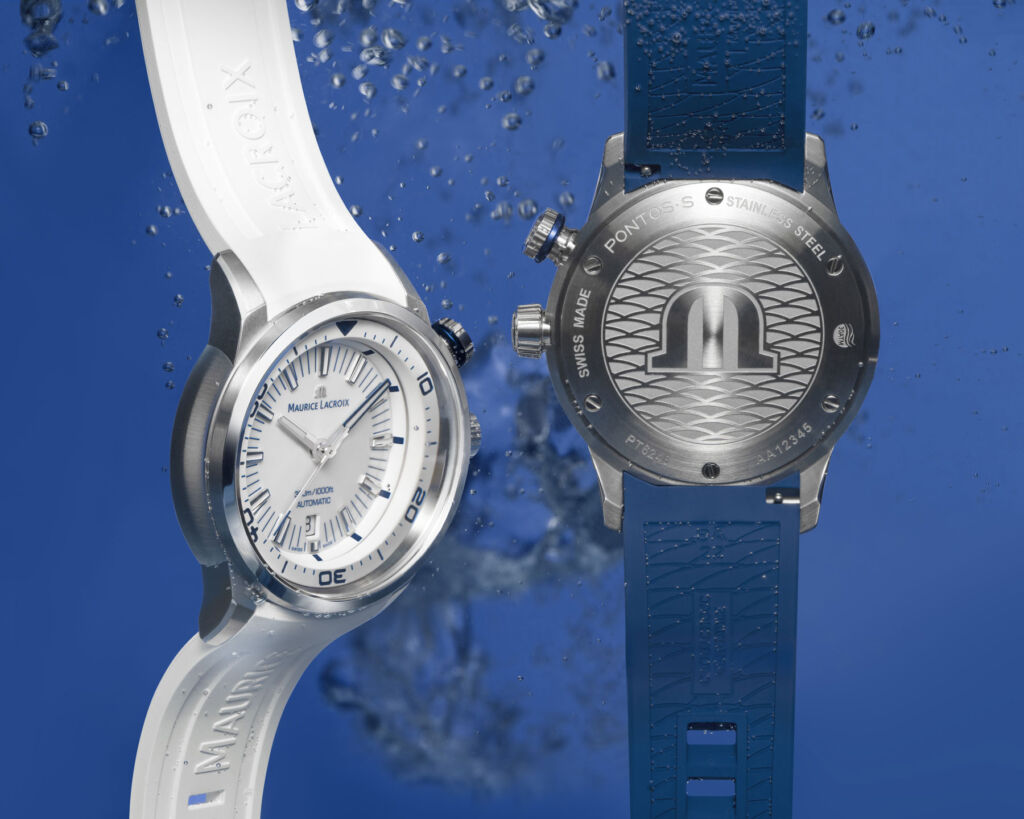 Two of the watches underwater, one showing the dial, the other the caseback