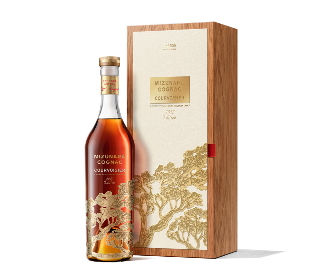 A bottle of the 2023 edition cognac next to its case