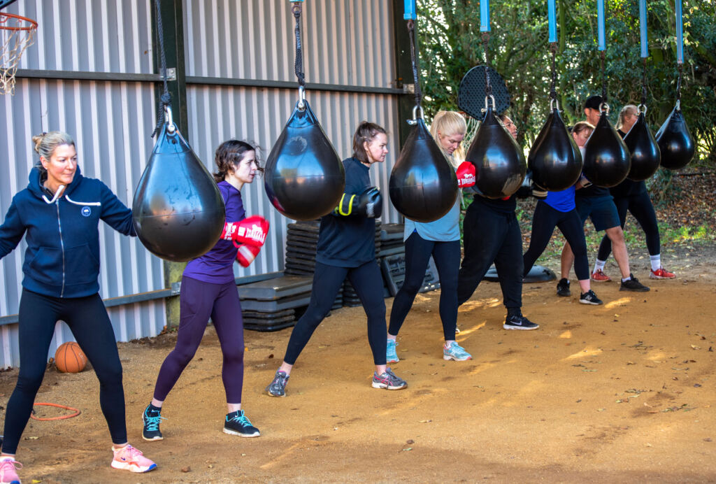 A group of ladies hitting the punch bags