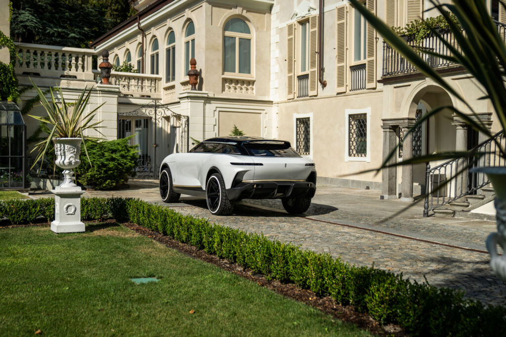 The concept car parked outside a large country house