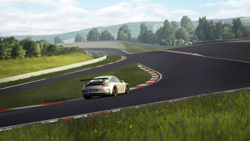 A rendering showing a Porsche sports car heading around the yet to be completed race circuit