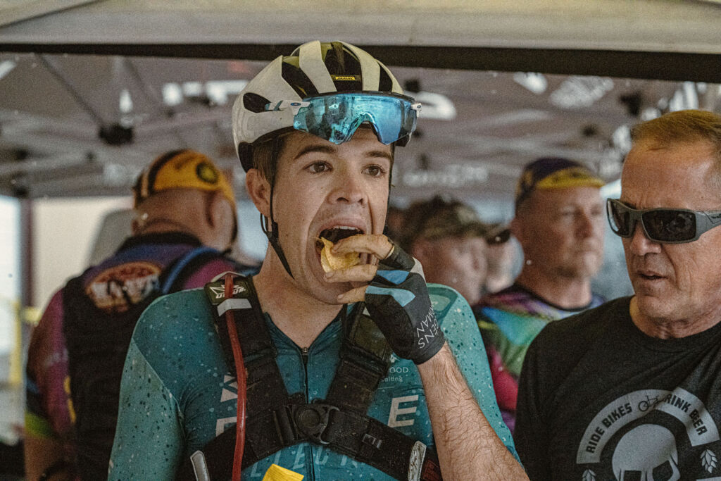 Joe snacking on some crisps in-between stages