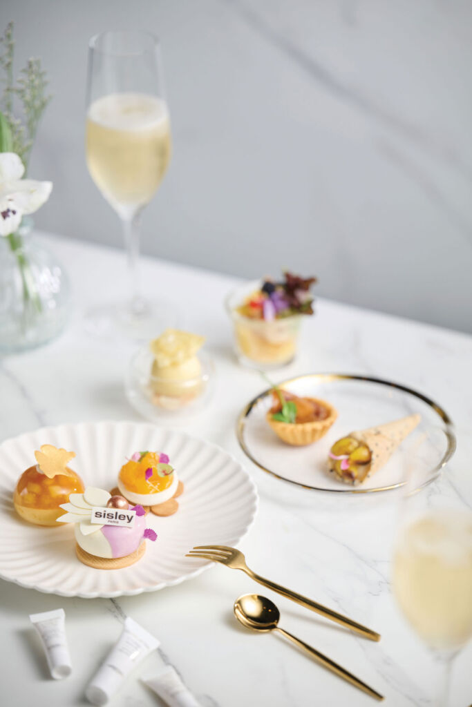 Items from the afternoon tea laid out on white china plates on a table