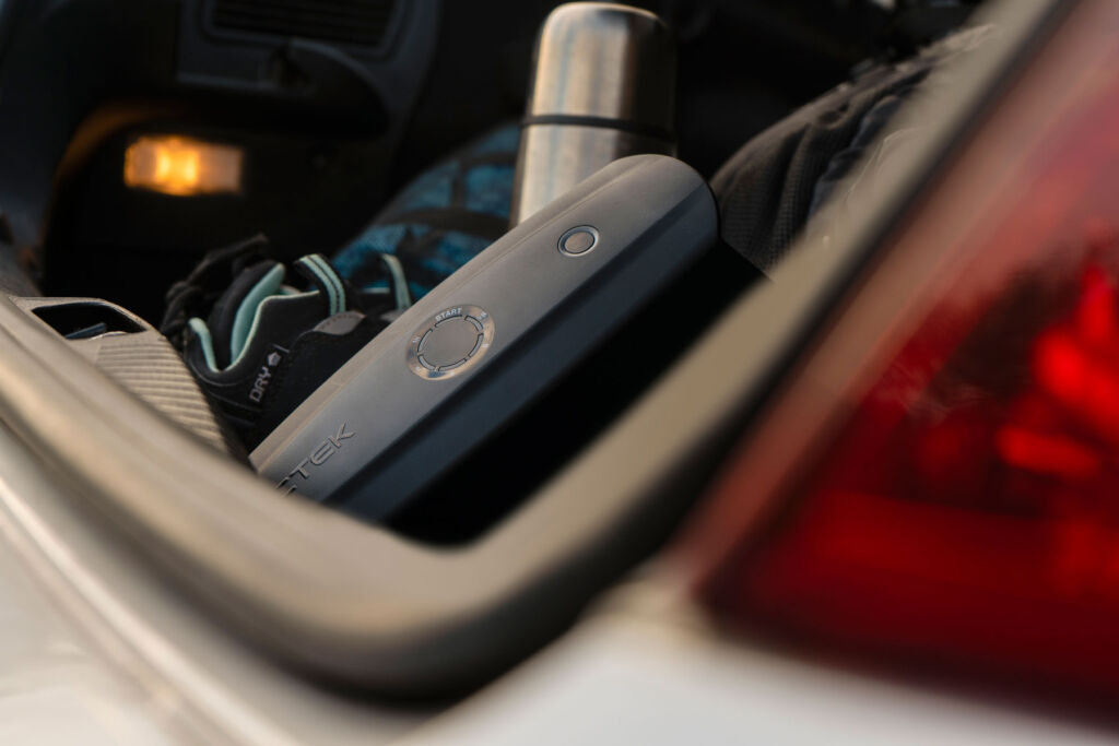 The multi-use power charger in the boot of a car