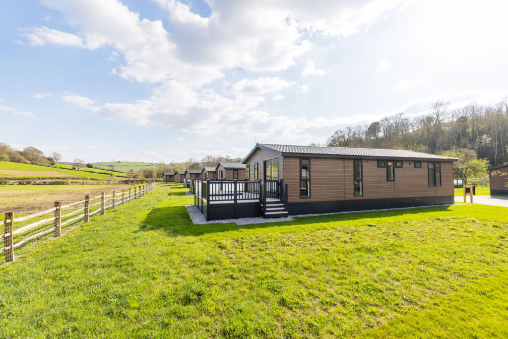 A side view of some of the new lodges set in the English countryside