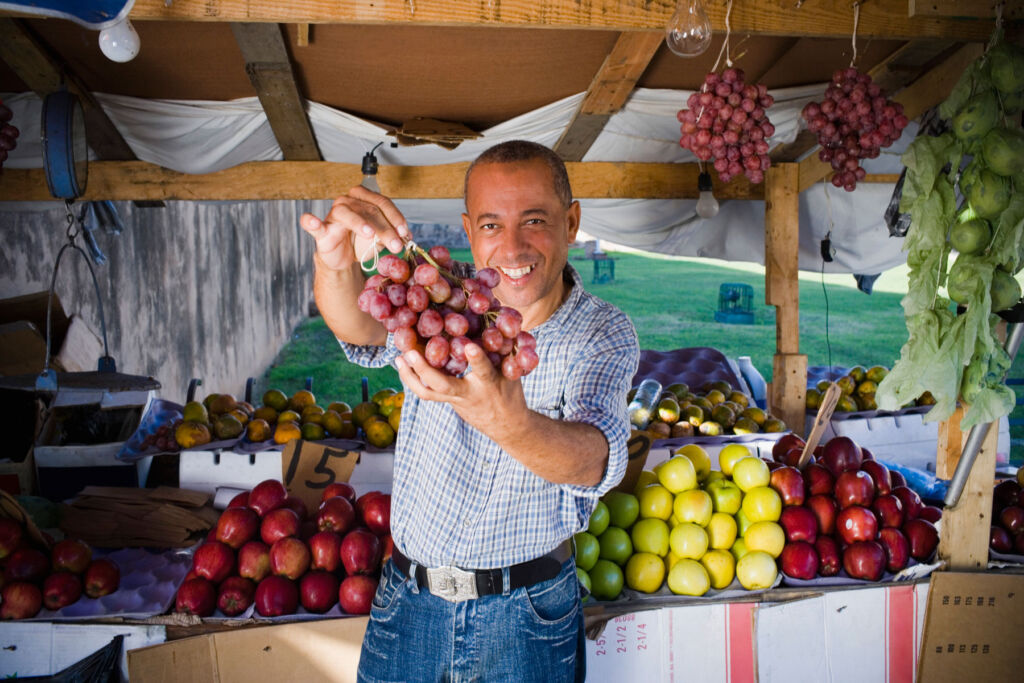 A very happy fruit seller
