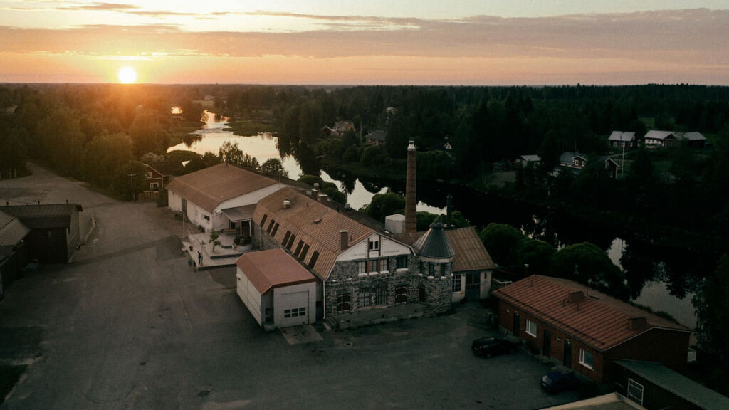 An aerial view of the distillery at sunset