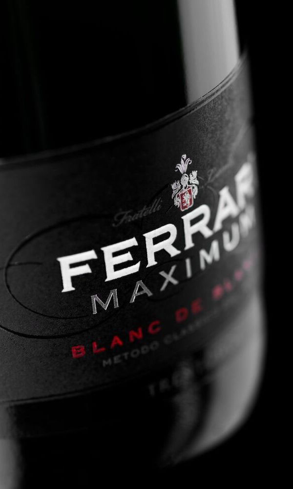 A close up view of the label on a bottle of Ferrari Maximum