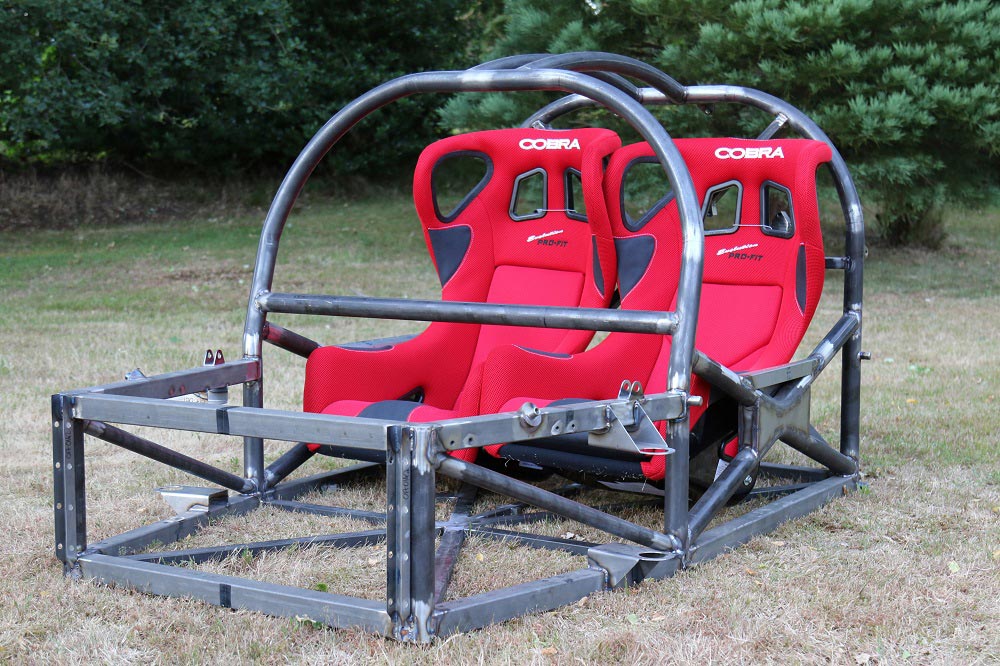 The chassis of the car with its two red Cobra race seats