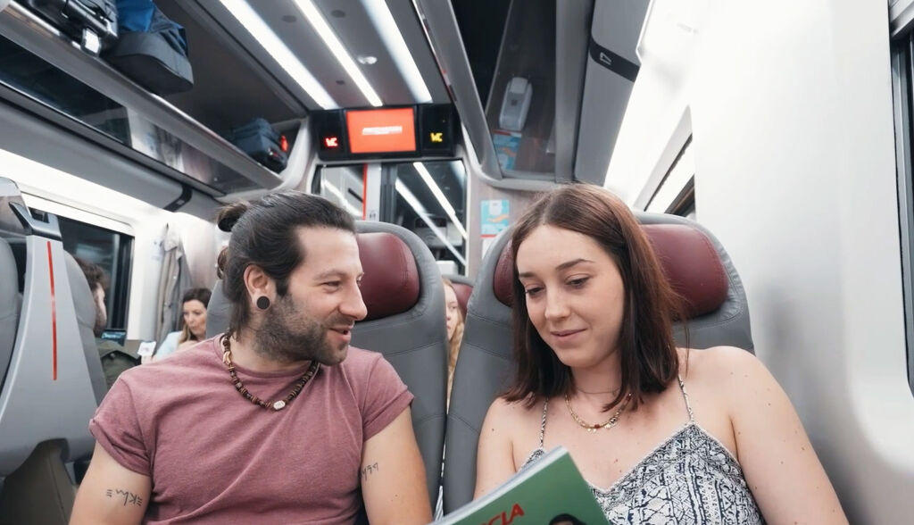 A couple enjoying travel in a train