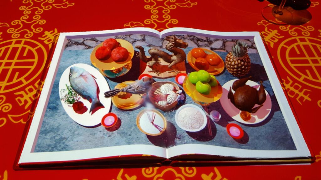 An open book displaying illustrations of a variety of foods