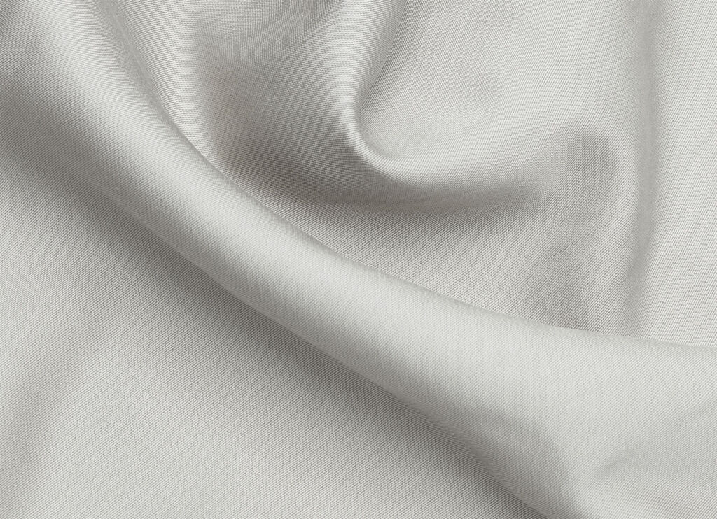 A close up view of a grey fitted sheet
